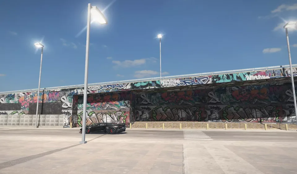 Ghost Driver car meet area with a graffiti wall and parked cars